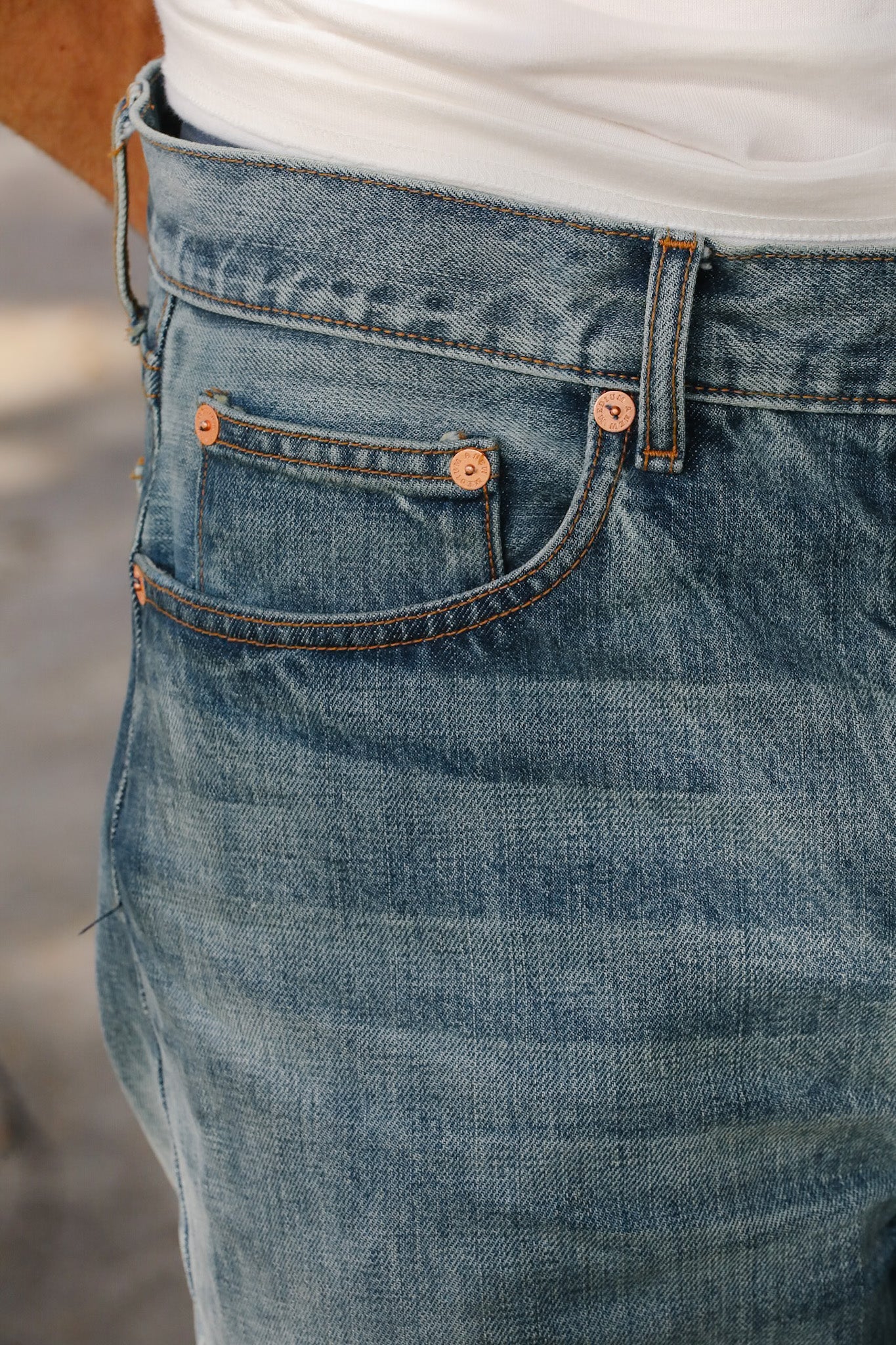 Close-up of blue jeans with a blurred background