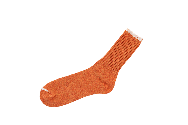 Orange ribbed crew sock with white toe and cuff details from Iron Shop Provisions