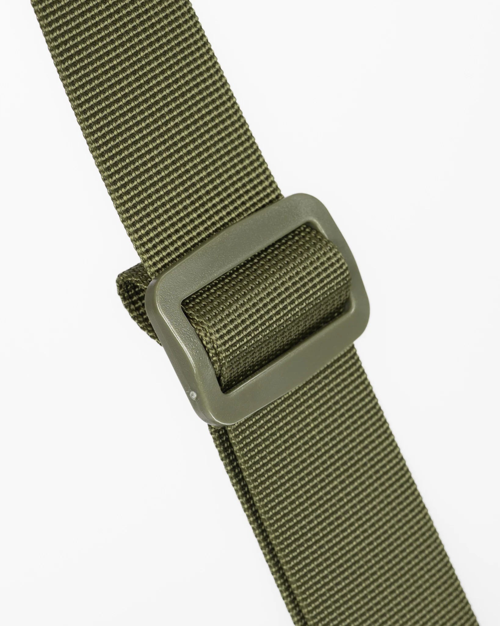 Close-up of an olive green webbed strap with a matching olive green plastic buckle, shown against a plain light gray background.