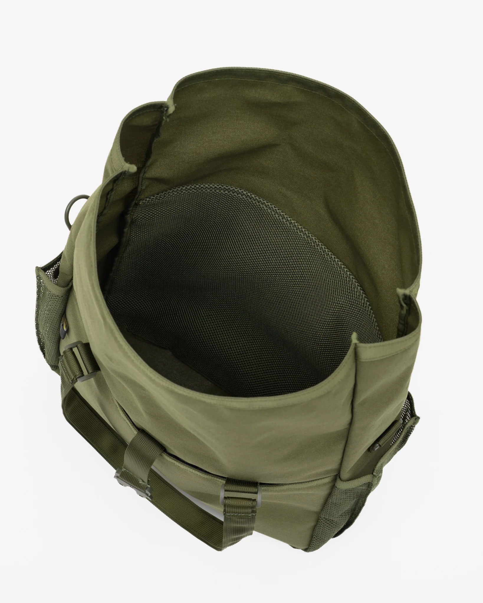 An olive green tactical backpack shown from a top-down view, highlighting its interior mesh pocket and side straps, set against a plain light gray background.
