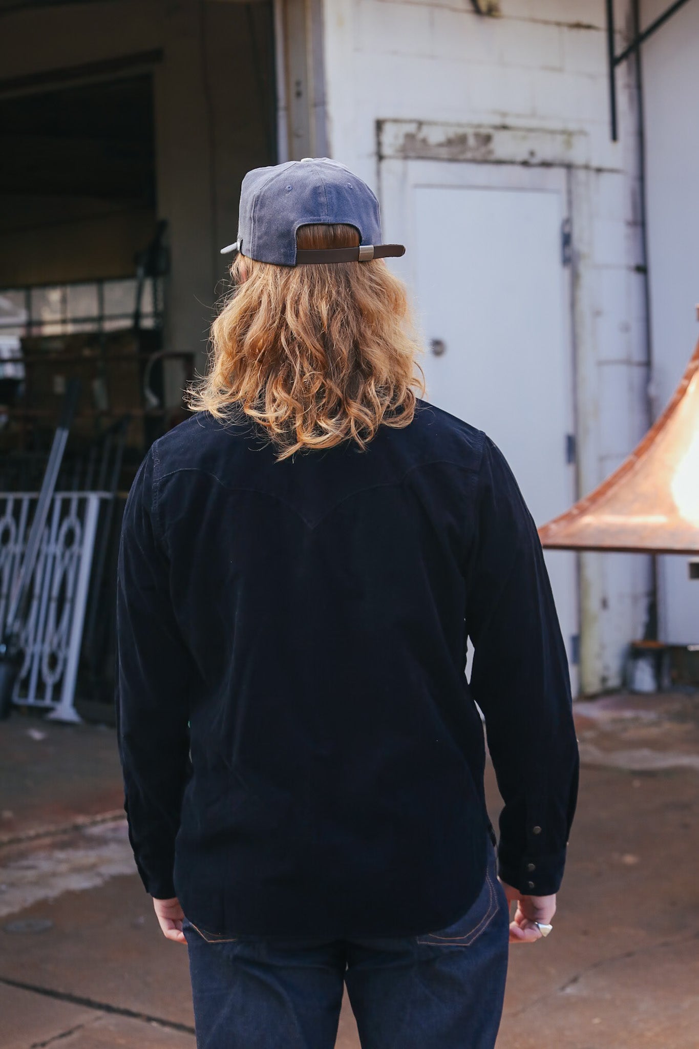 man wearing black corduroy western shirt