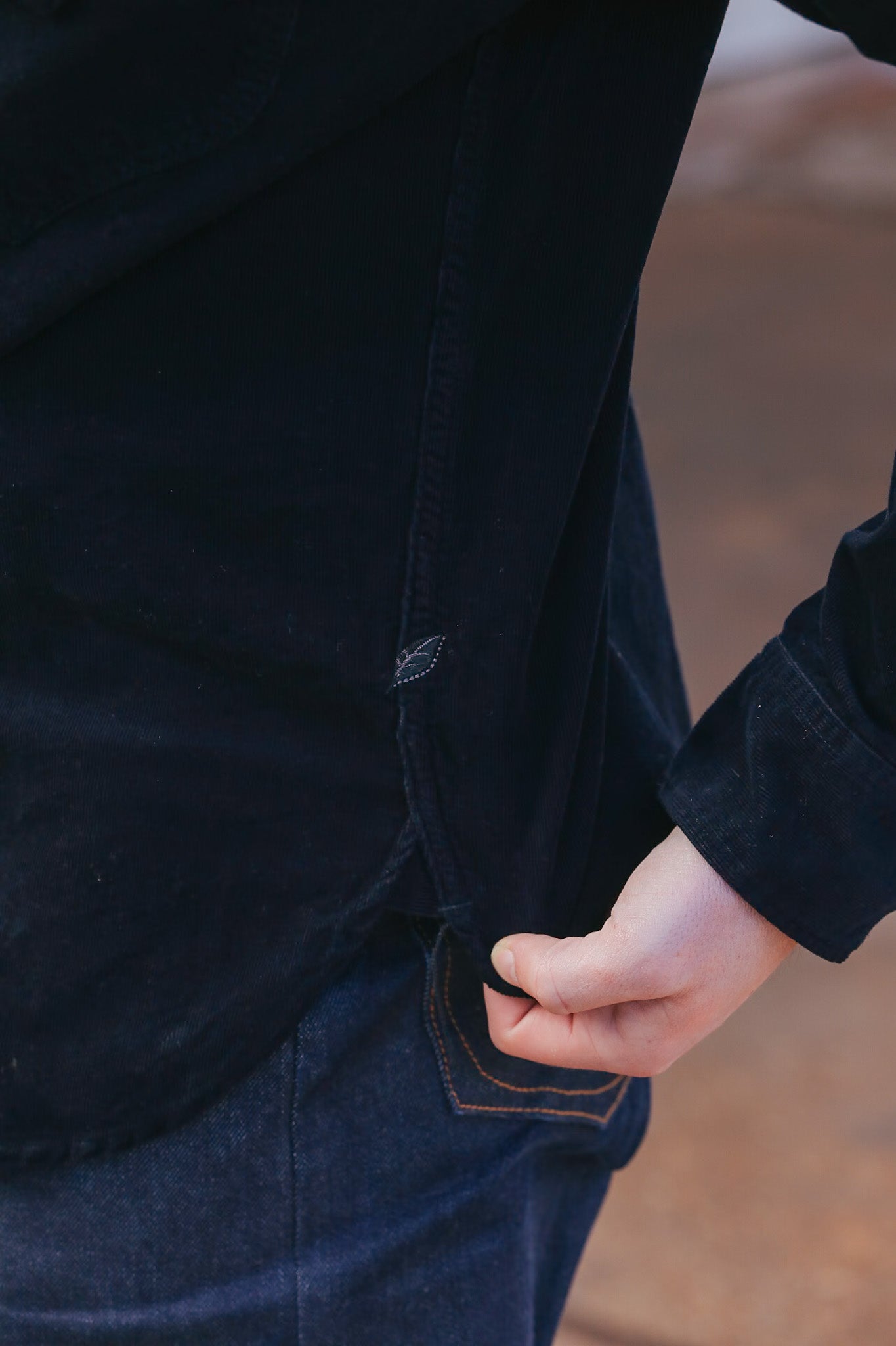 man wearing black corduroy western shirt