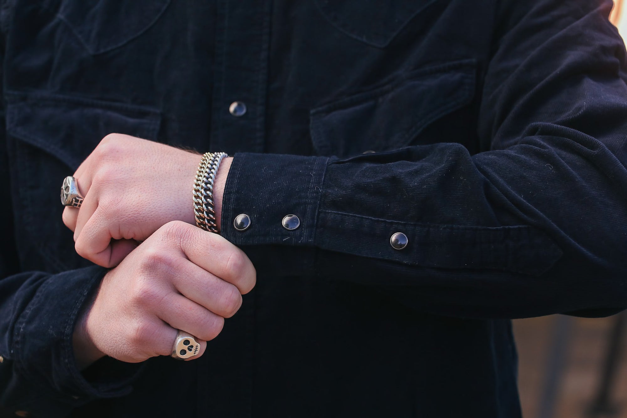 man wearing black corduroy western shirt