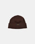 Dehen 1920 wool knit watch cap in brown with folded cuff and small black label, isolated on light background