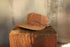 Brown cap on a wooden block with a blurred background