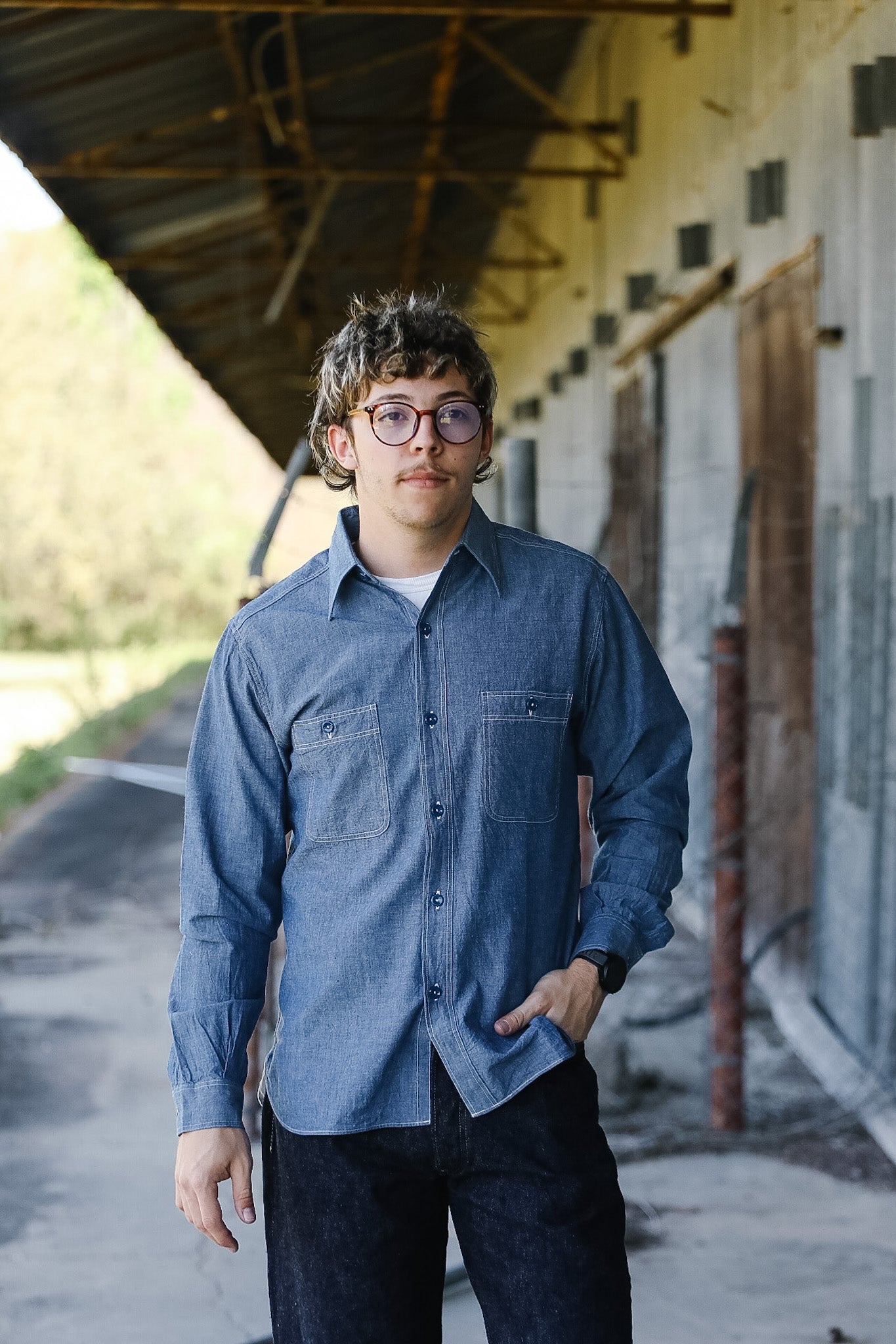 Man standing wearing Chambray Shirt 