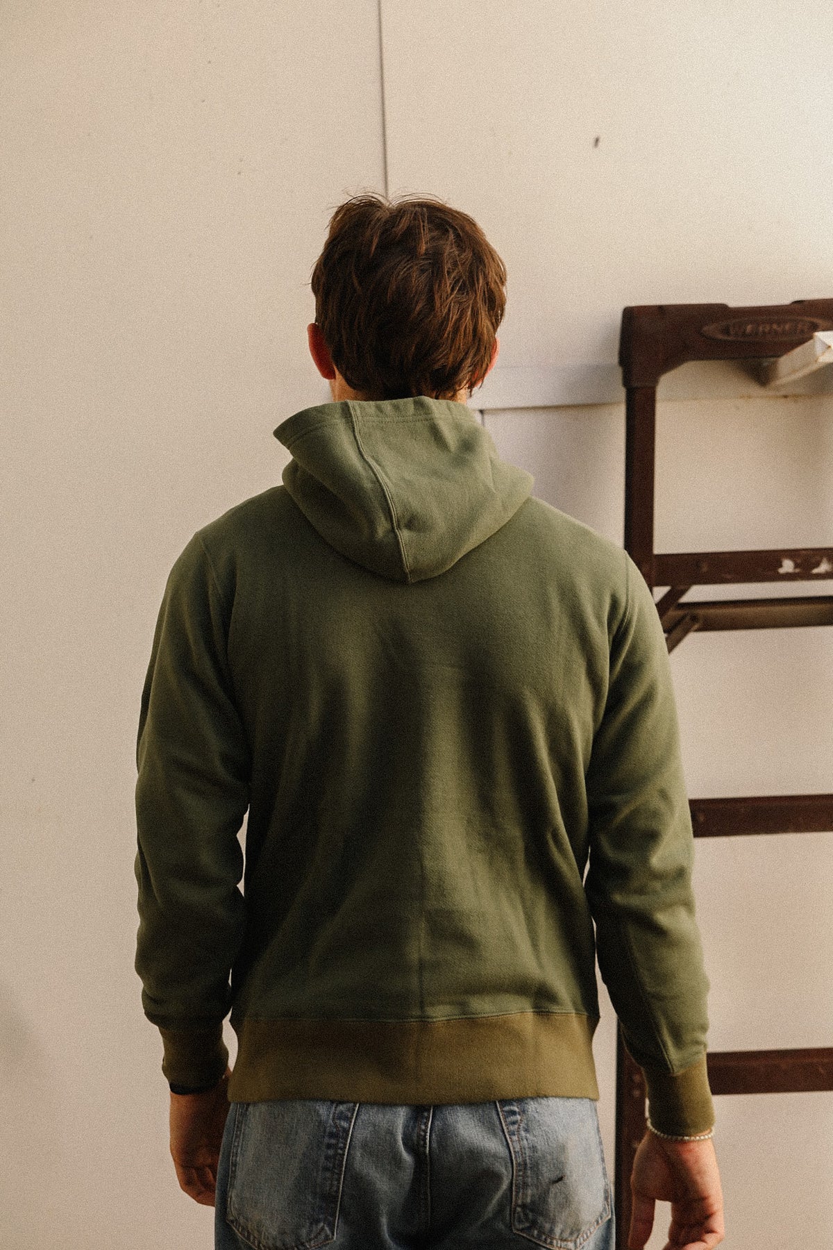 Close up detail of a dark green sweater 