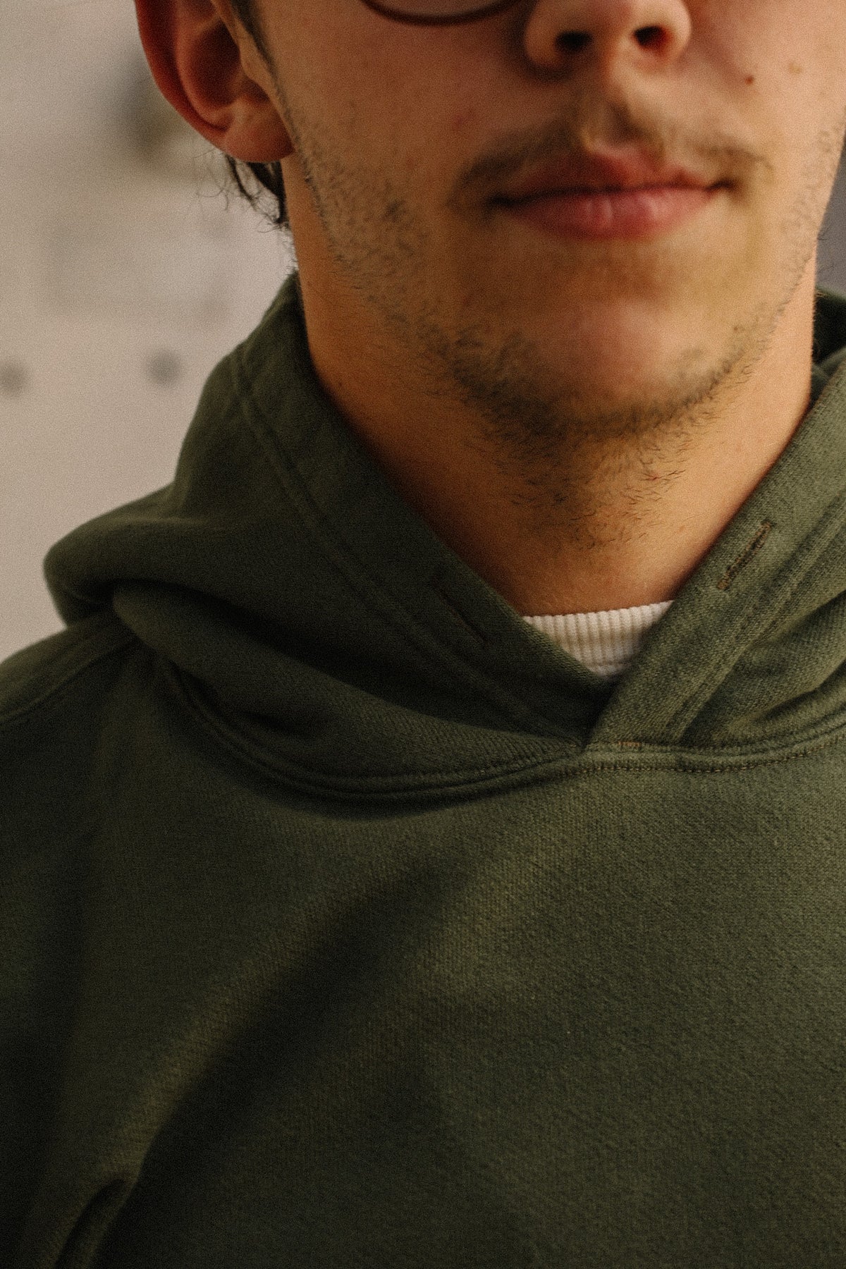 Close up detail of a dark green sweater 