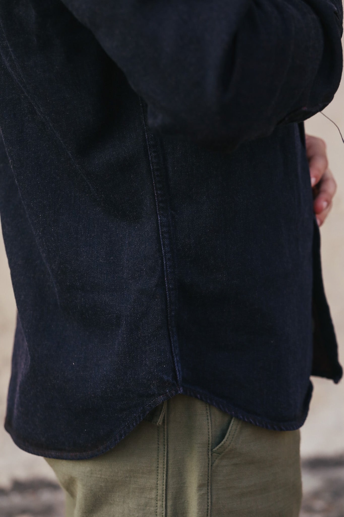 Navy blue coat with a blurred background