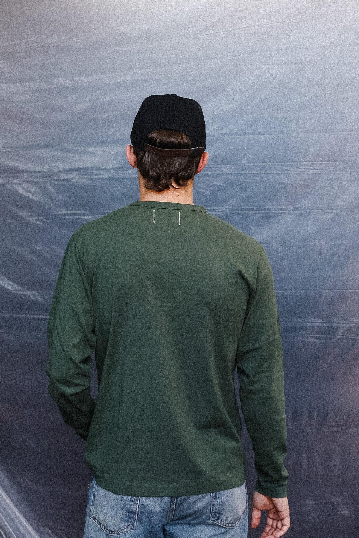 Up close detail of green long sleeve t-shirt