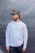 Man wearing long sleeve white t shirt