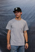 man wearing a grey t-shirt