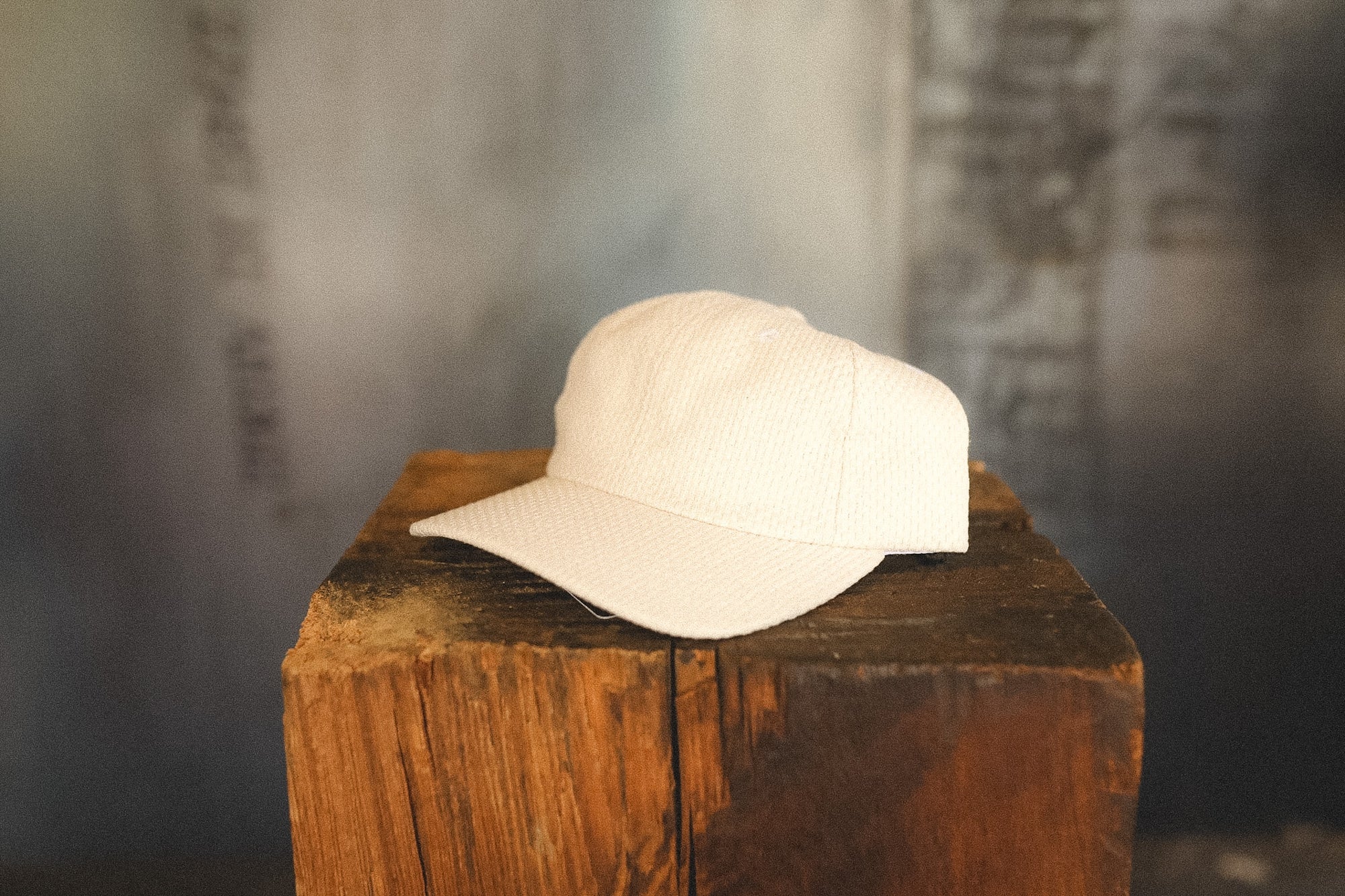 White cap on a wooden block with a blurred background