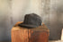 Black cap on a wooden block with a blurred background