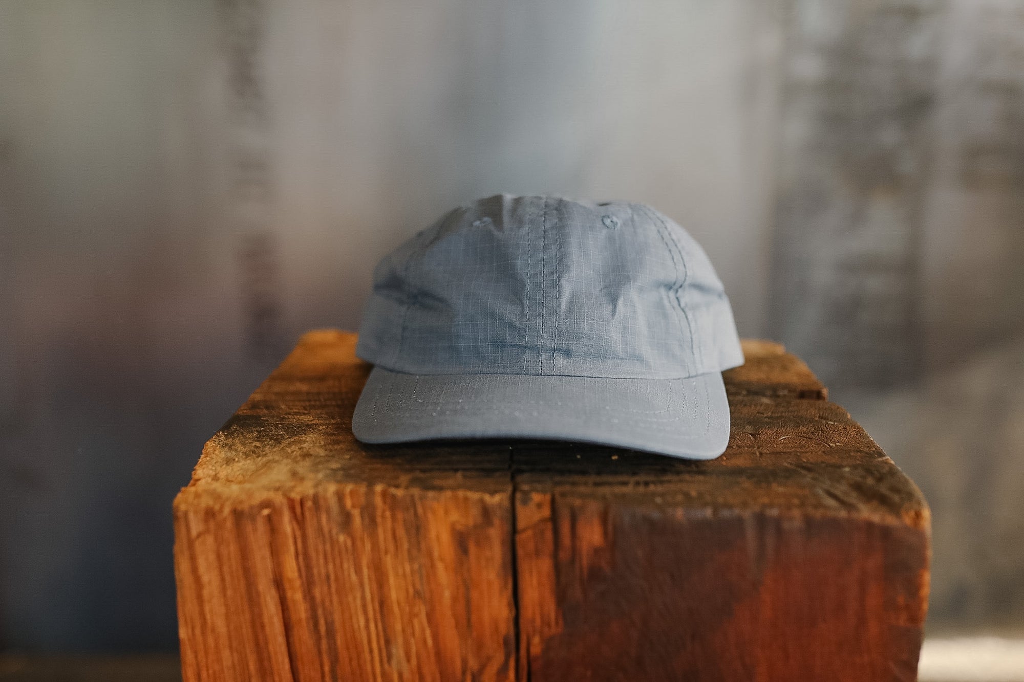 Blue cap on a wooden block with a blurred background