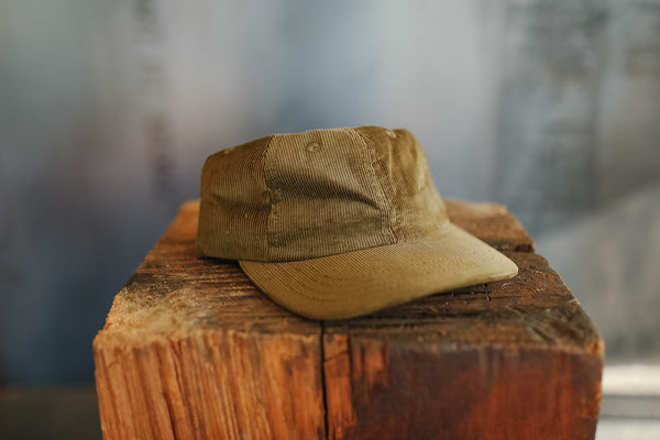 Brown cap on a wooden block with a blurred background