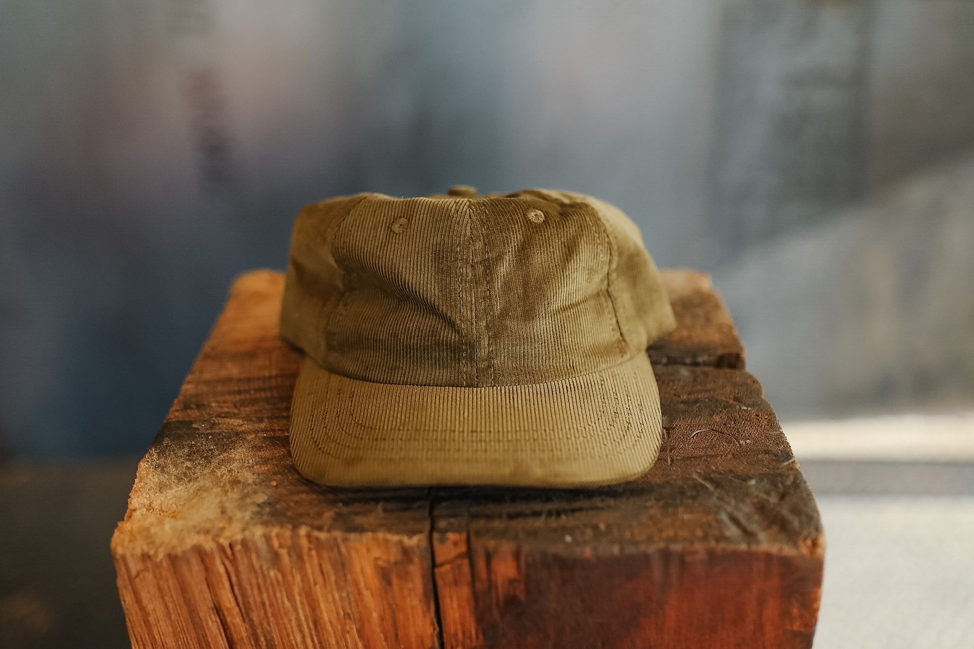 Brown cap on a wooden block with a blurred background
