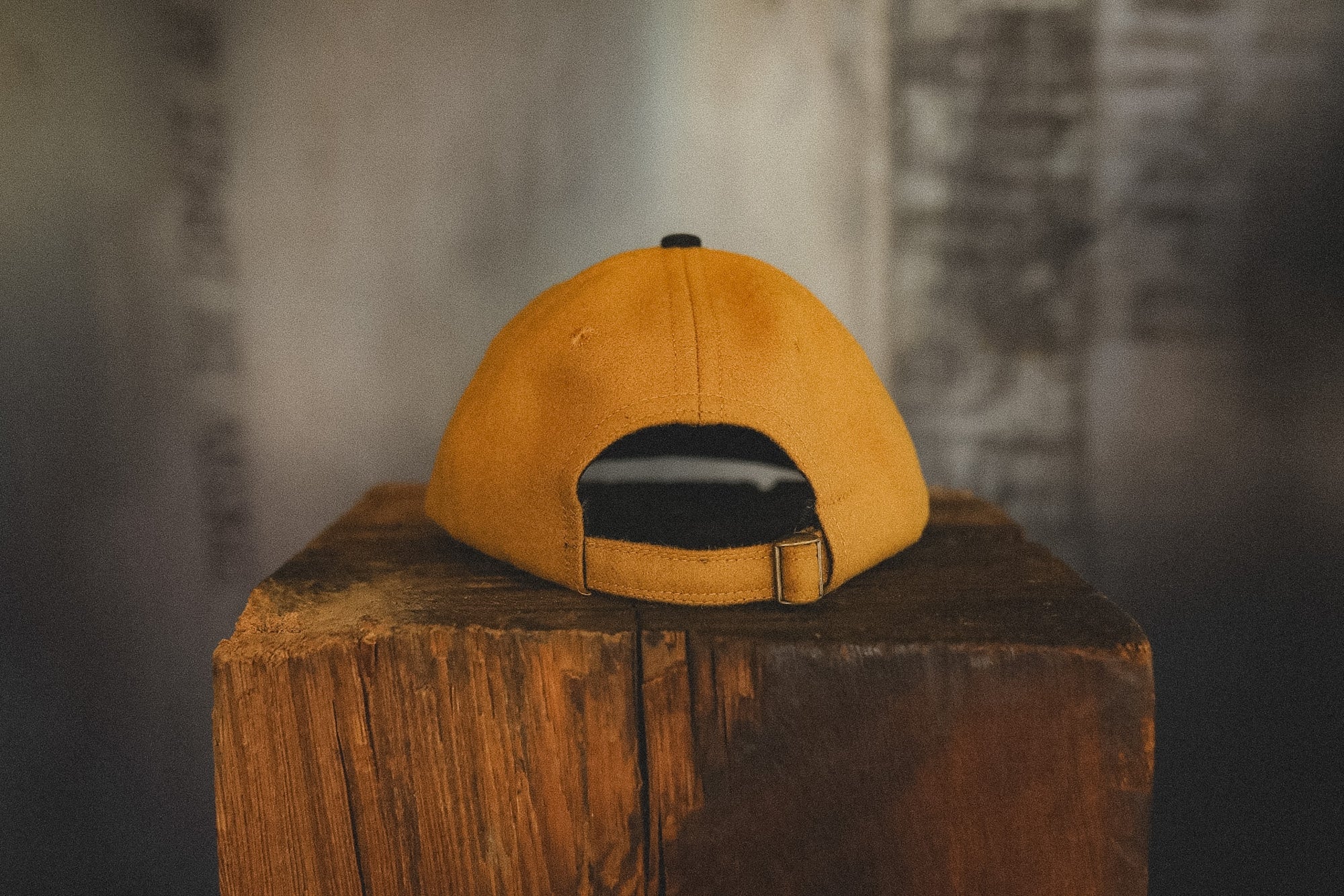 Yellow cap on a wooden block with a blurred background