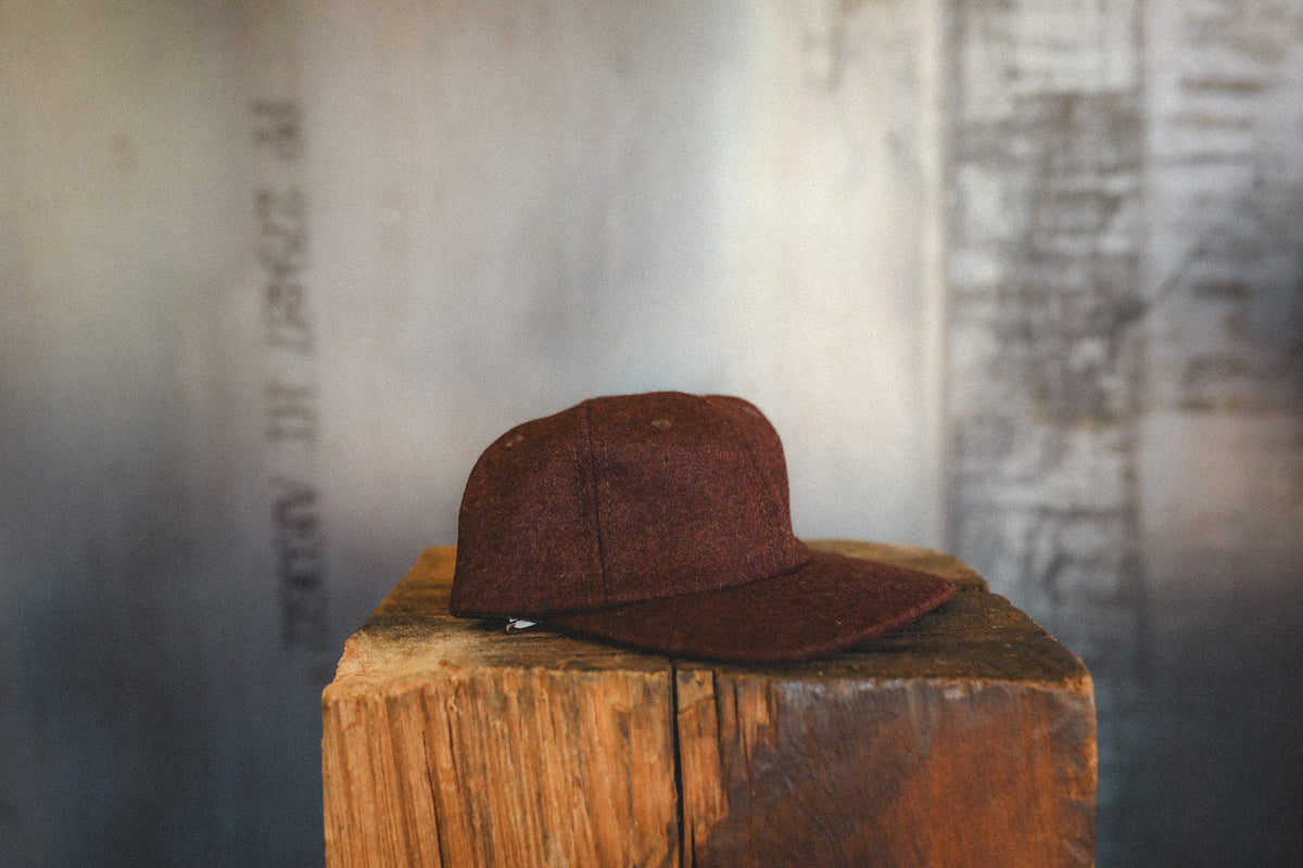 red cap on a wood block 