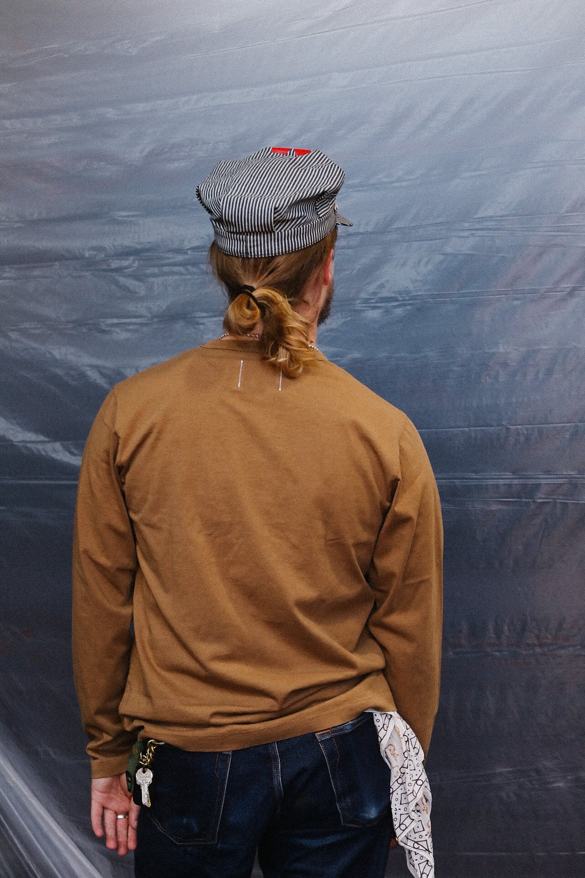 close up detail of brown long sleeve t-shirt