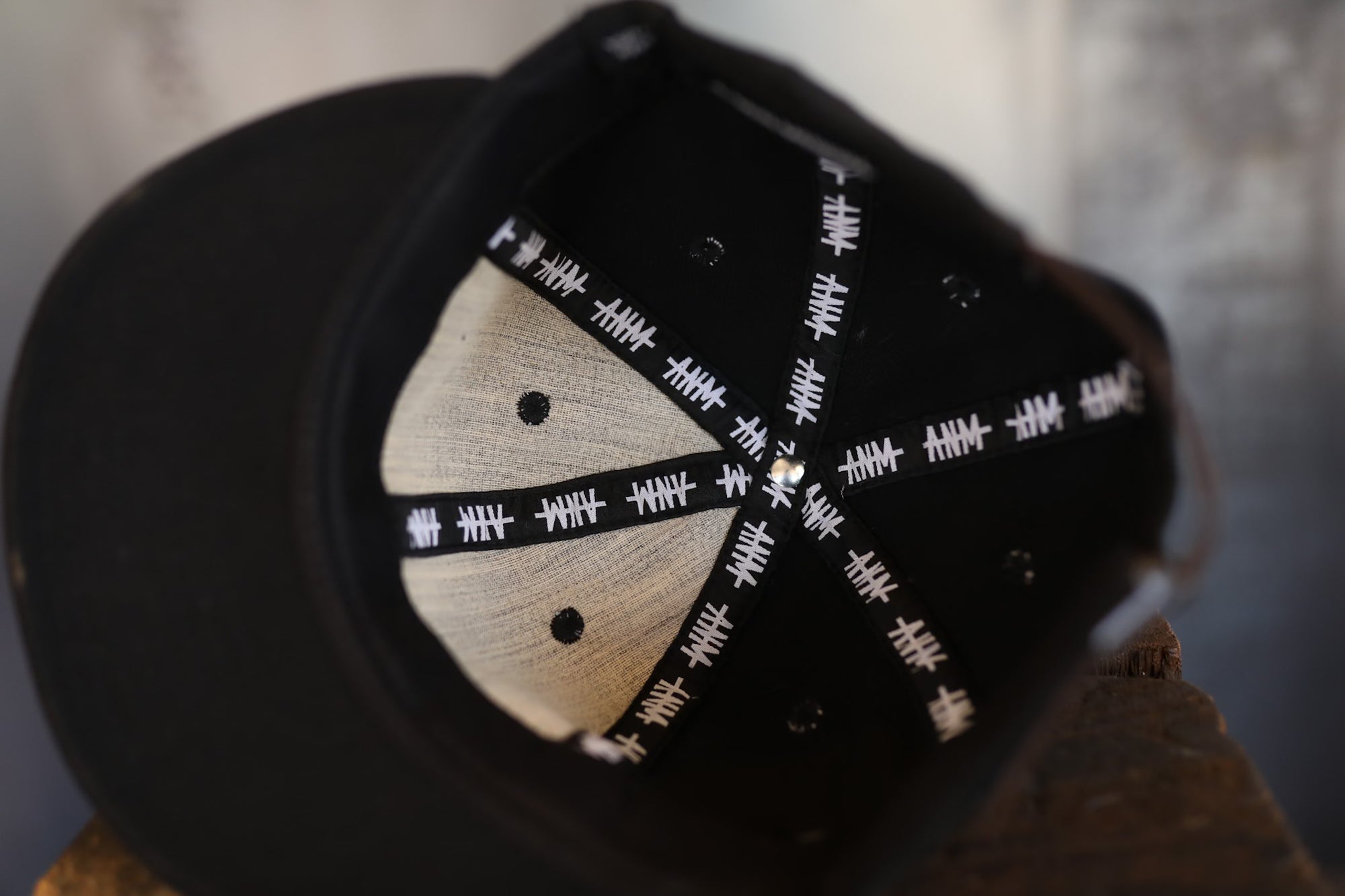 Close-up of a wooden product with black texturing on a blurred background