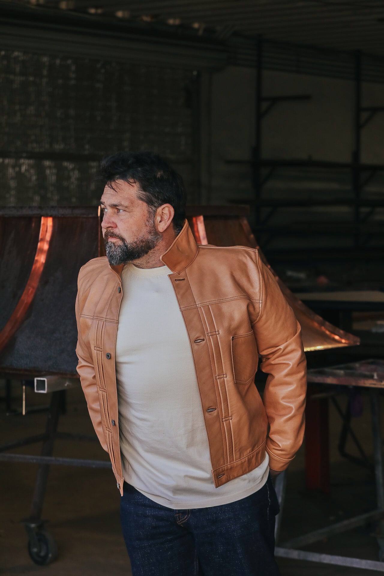 Man wearing leather jacket with white shirt 