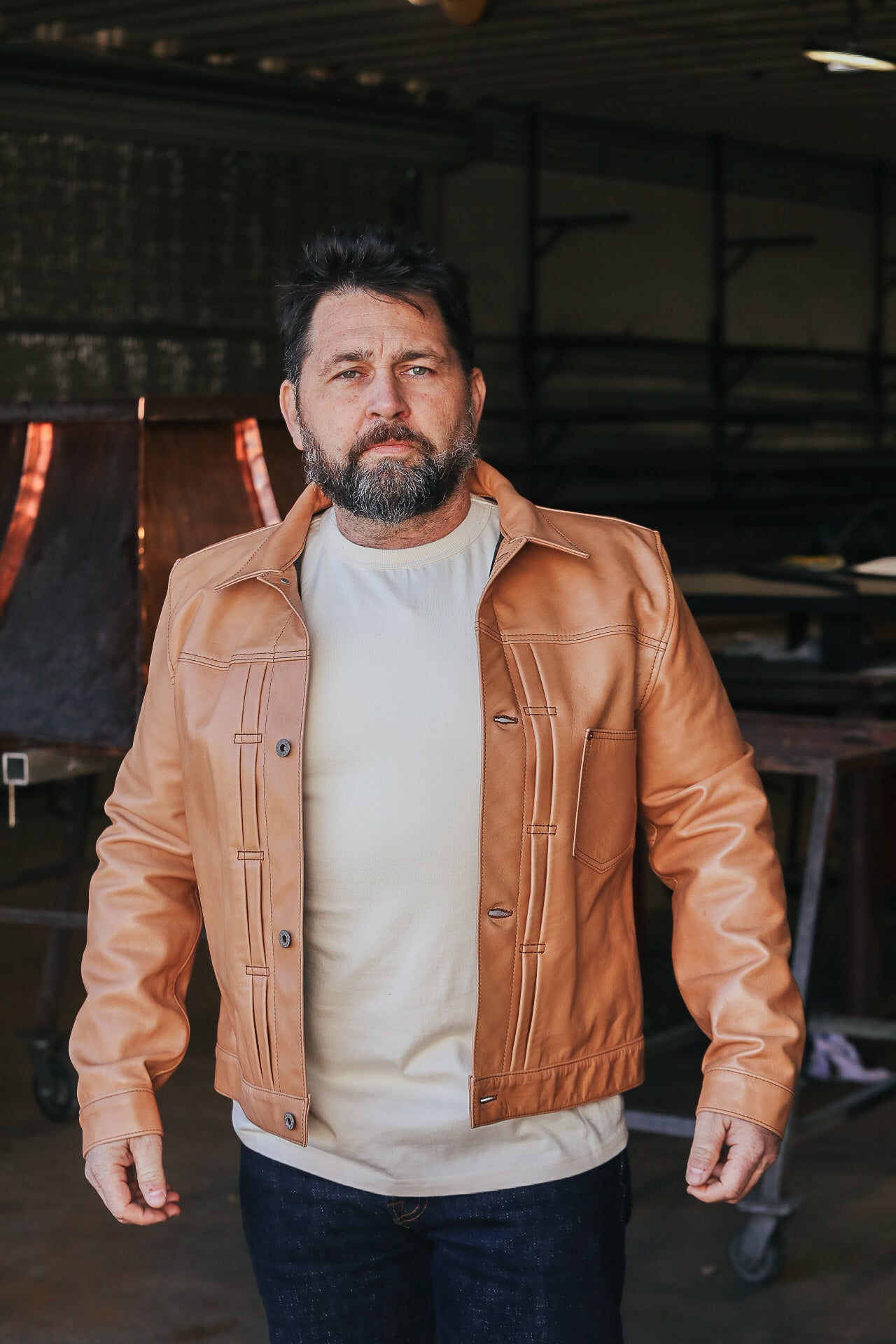 Man wearing leather jacket with white shirt 