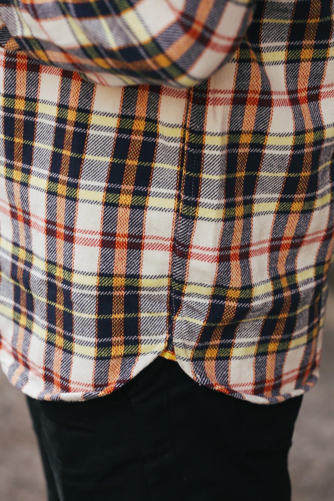 Close-up of a plaid shirt with a blurred background