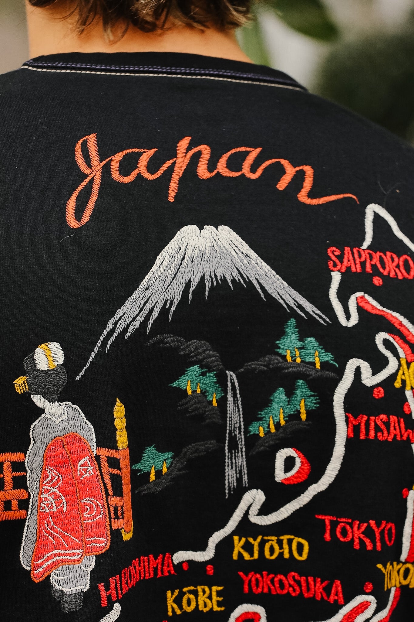 Embroidered jacket with Japanese-themed design featuring Mount Fuji and traditional figures.