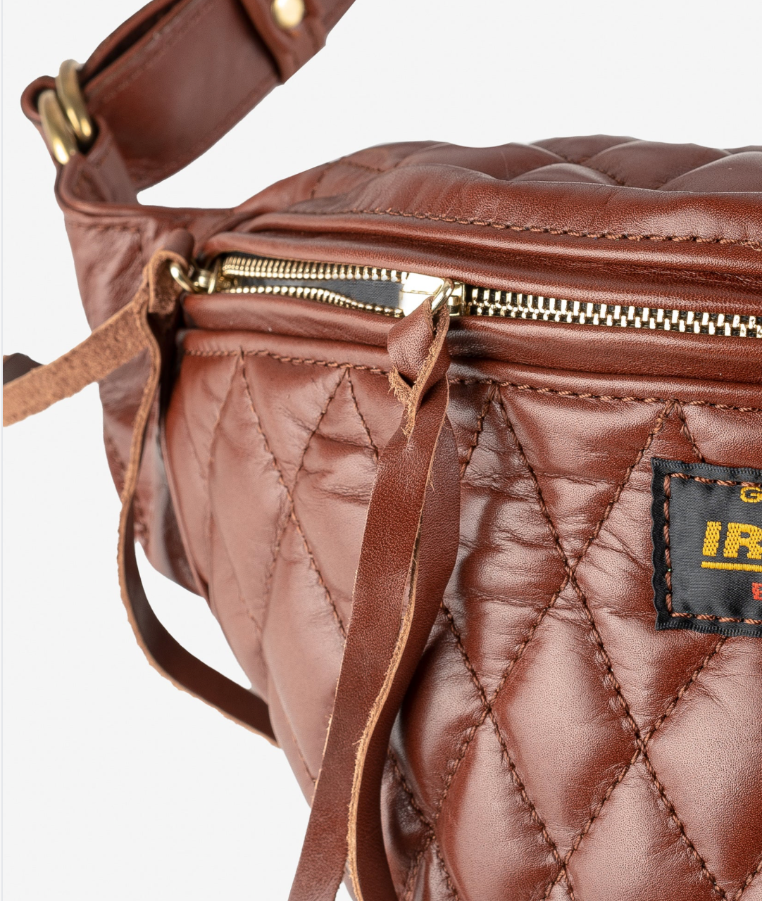 Brown quilted bag with a visible brand label on a white background