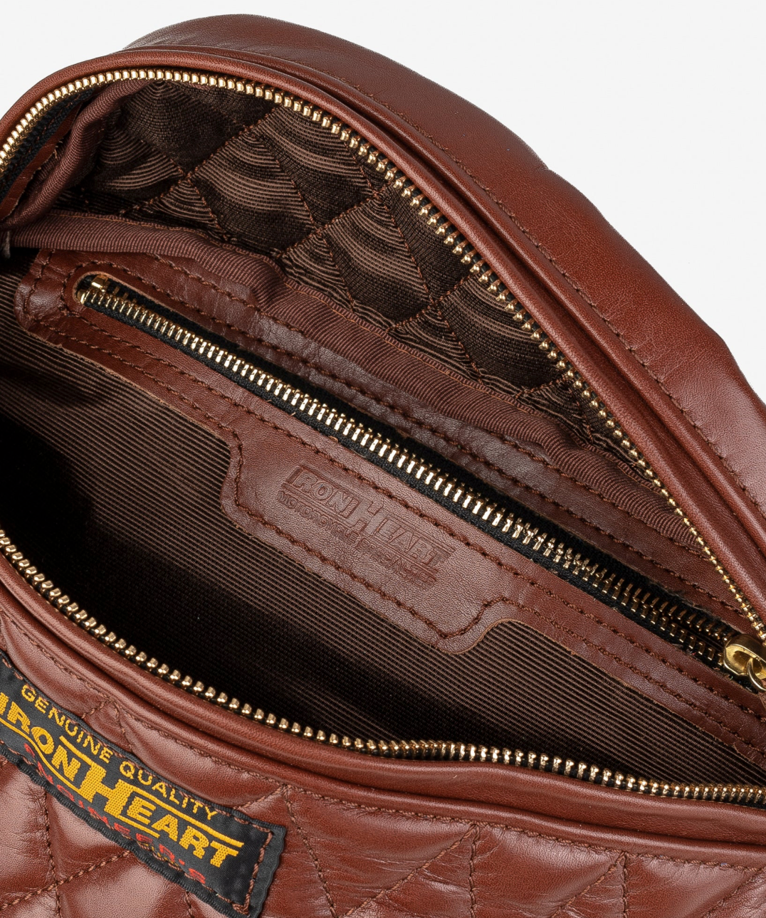 Brown leather bag with visible brand label on a white background
