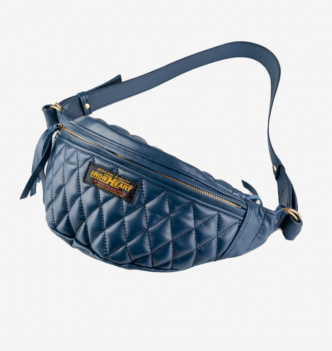 Blue quilted waist bag with a brand label on a light gray background