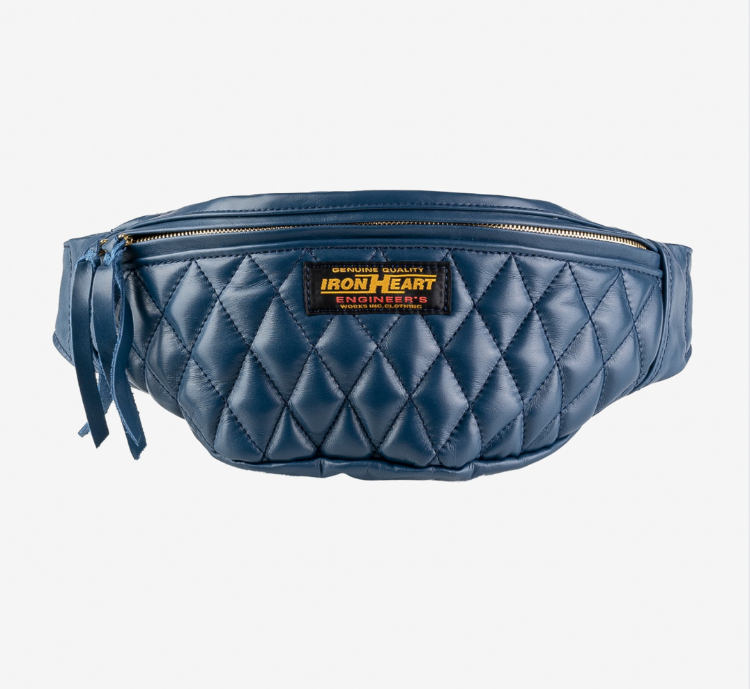 Blue quilted fanny pack with Iron Heart logo on a white background