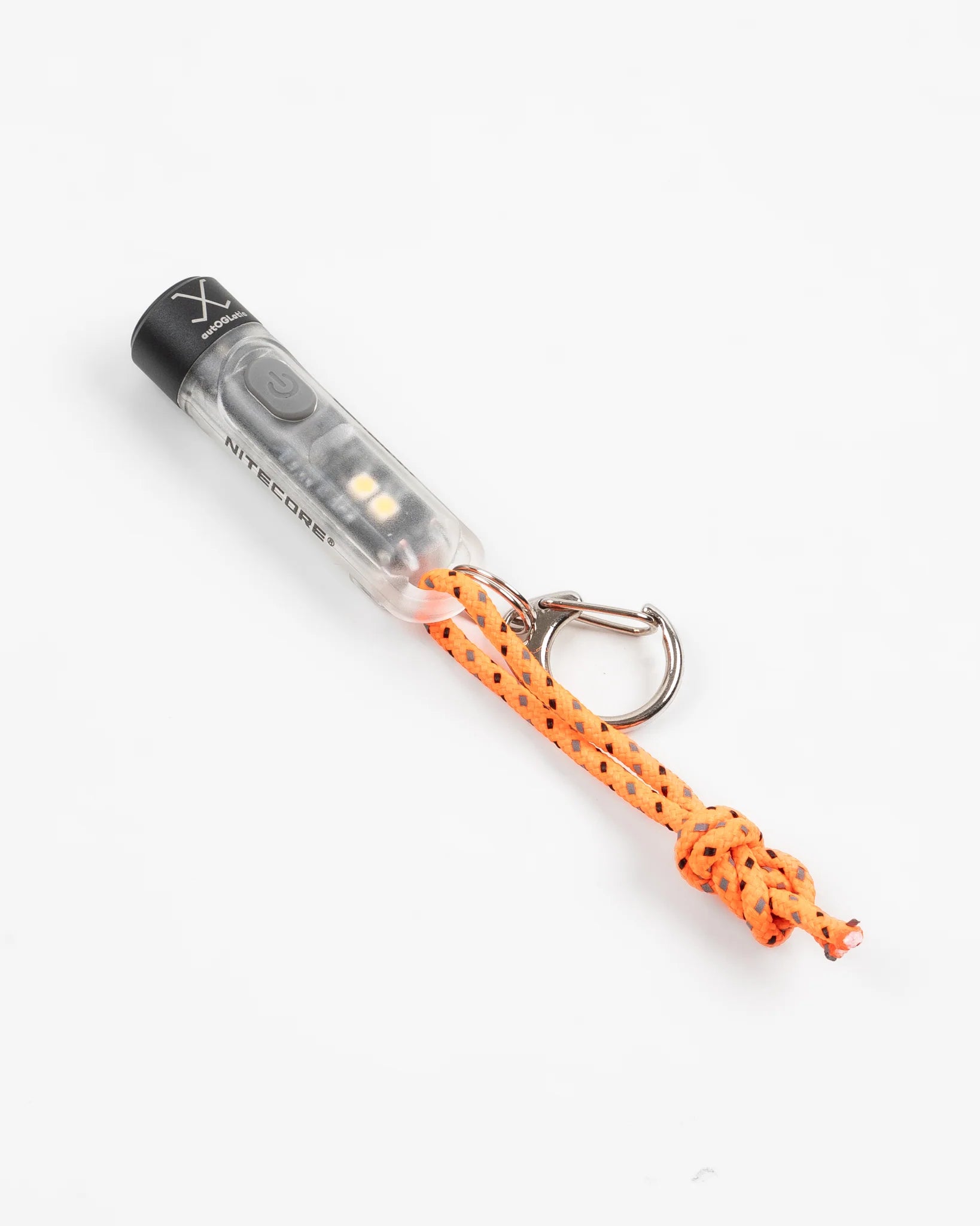 Nitecore transparent compact keychain flashlight with orange cord and metal ring on white background