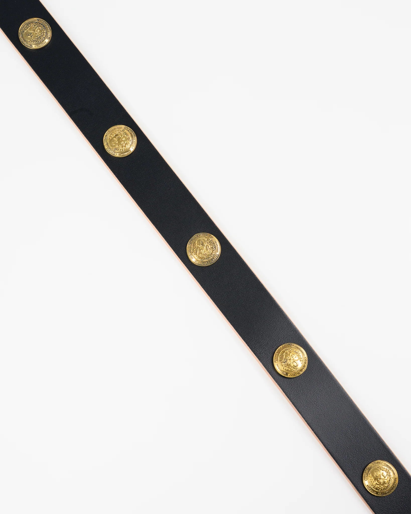 Black belt with gold buttons on a white background