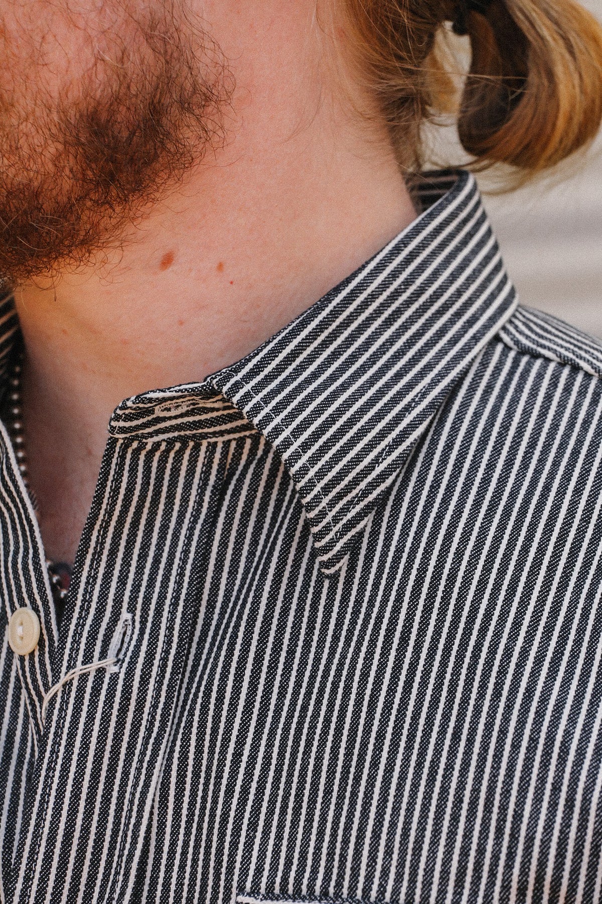 Up close detail of striped denim shirt