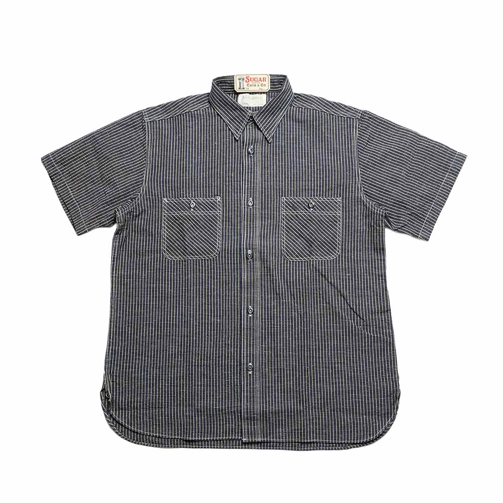 Black and white striped shirt with two front pockets on a white background