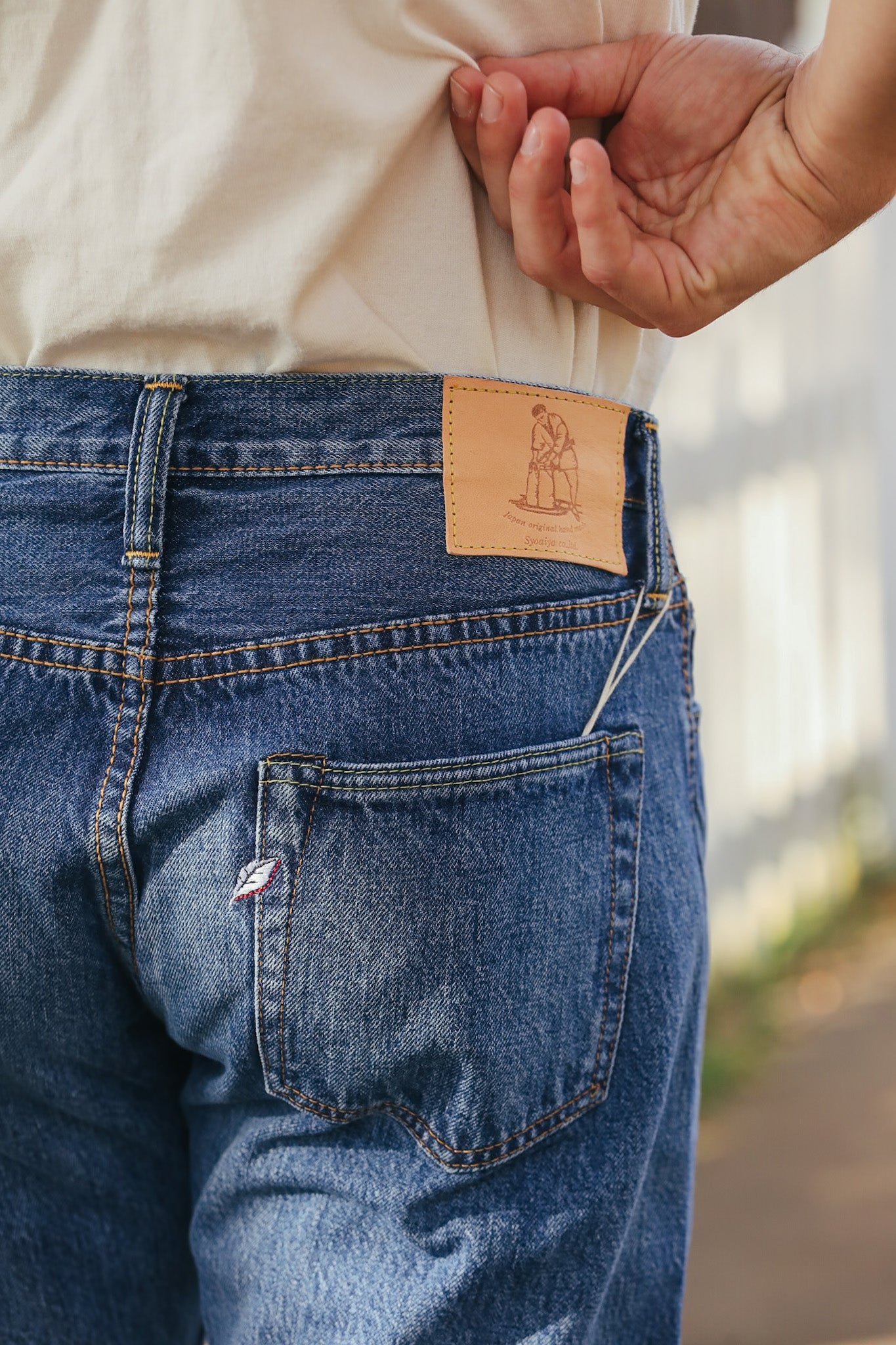 man wearing light color jeans 