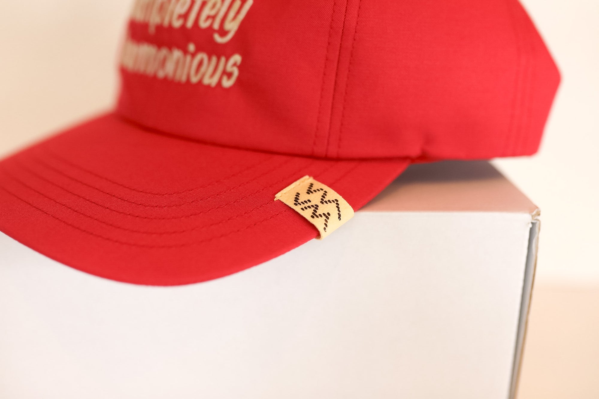 Red cap with text on a white box