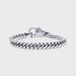 Sterling silver curb chain bracelet with polished links on a plain light background