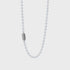 Silver ball chain necklace with textured clasp engraved Good Art HLWD on gray background